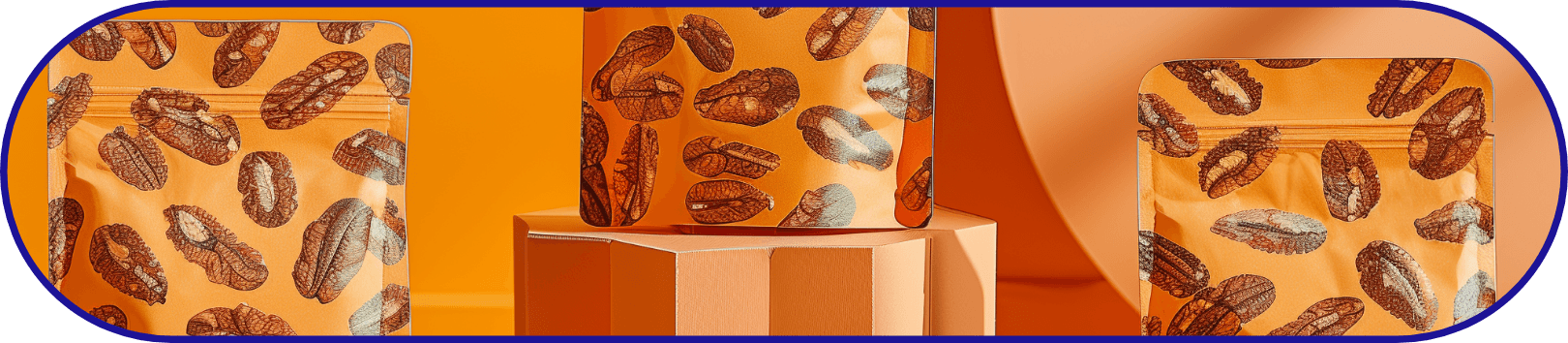 Bright orange stand-up pouches with nut patterns, modern packaging design with nuts scattered on table.