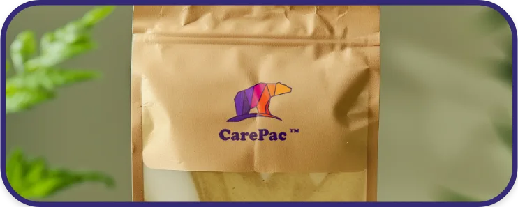 Detailed view of a brown kraft stand-up pouch featuring the colorful CarePac bear logo, emphasizing custom printed compostable packaging.