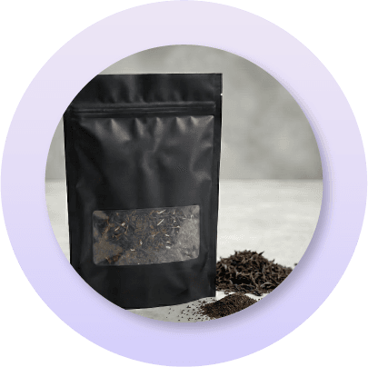 Black plow bottom pouch with viewing window used for coffee and tea packaging, providing freshness protection, shelf stability, and a premium retail presentation.
