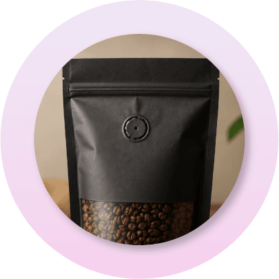 Coffee packaging pouch with one-way degassing valve that allows carbon dioxide to escape while protecting roasted coffee beans from oxygen exposure.